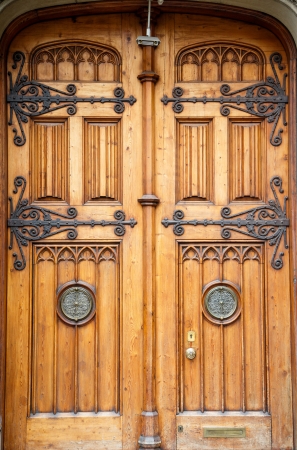 A set of old custome wood doors with brass hinges and insertsの写真素材