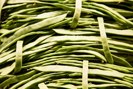Many green beans in a vegetable marketの写真素材