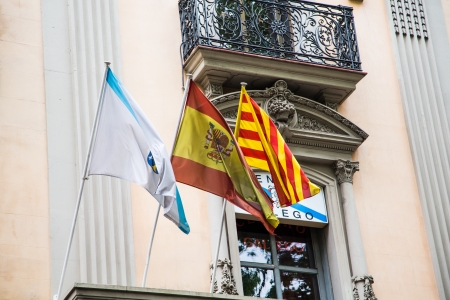 Flags of Barcelona, Spain and Catalonia on an old building on La Ramblaの写真素材