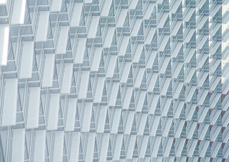 Many windows in curved white wall of modern hotelの写真素材
