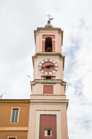 A pink plaster clock tower in Nice, Franceの写真素材