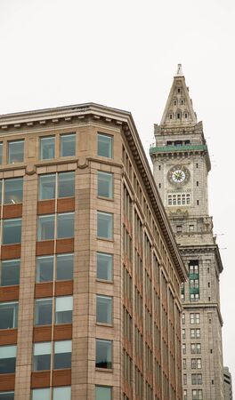 An old office building and a classic clock tower in Boston, Massachussettsの写真素材