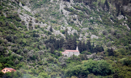 An old stone church clinging to a mountainside near Kotor in Montenegro