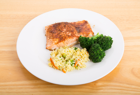 Baked Salmon Fillet with Steamed Broccoli and Rice Pilafの写真素材