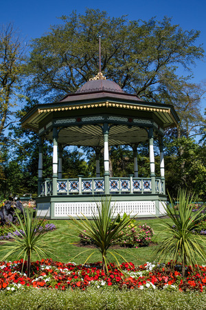 Ornate wood gazebo in a formal gardenの写真素材