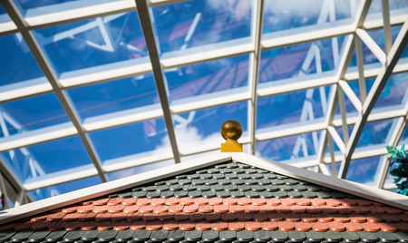 White steel and glass atrium ceilings under blue skiesの写真素材