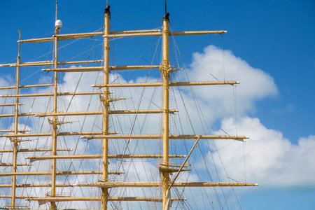 Wood masts of an old clipper ship against a nice sky