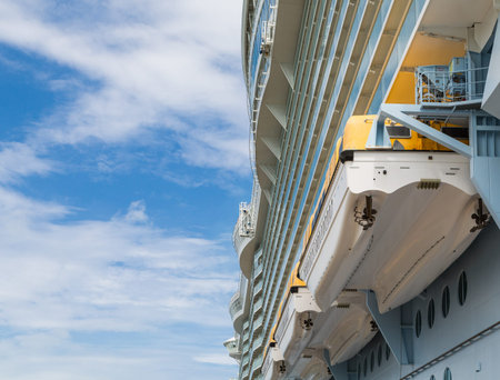 Lifeboats Hanging from  Side of  Luxury Cruise Shipの写真素材