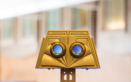 A gold telescopic viewer with blurred backgroundの写真素材