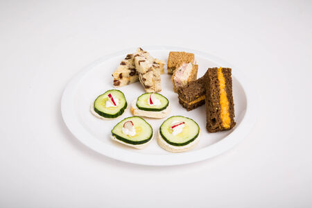 A selection of tea sandwiches with sliced cucumber and pimento cheeseの写真素材