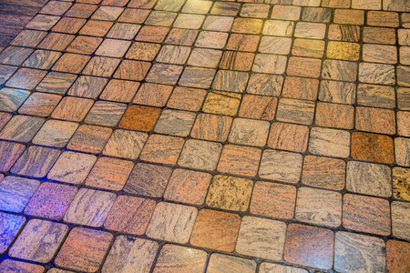 A colorful wood pattern stone tile floor useful for background or textureの写真素材