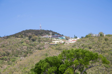Skylift and buildings on a green tropical hillside on St Thomasの写真素材