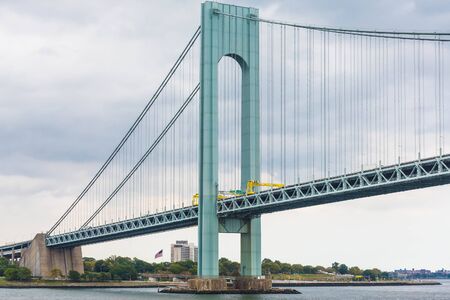 The Verrazano Bridge under grey skies on a foggy day in New York Cityの写真素材