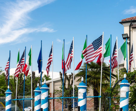 American and Italian flags at a dock in Murano near Venice