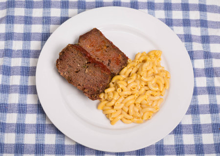Slices of meatloaf with macaroni and cheeseの写真素材