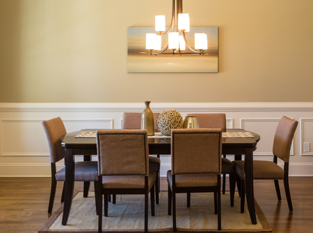 A modern dining room table and chairsの写真素材
