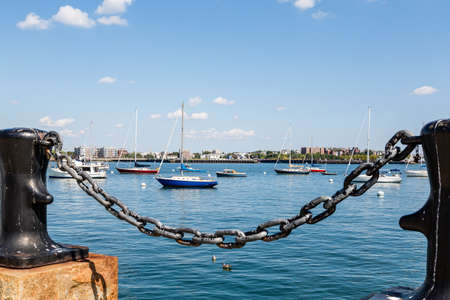 Sailboats in Calm Blue Bay of Boston Harborの写真素材
