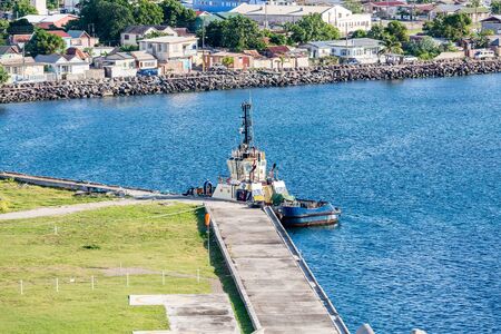 Tugboat docked at a pier on St Kittsの写真素材
