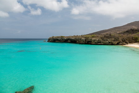 Clear aqua water off the rocky coast of Curacaoの写真素材