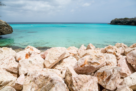 Clear aqua water off the rocky coast of Curacaoの写真素材