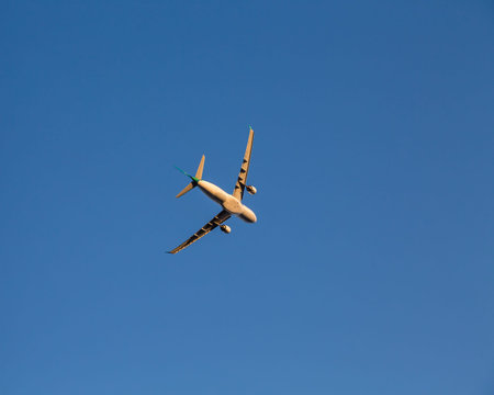 Airplane Banking for a Turn against a blue sky