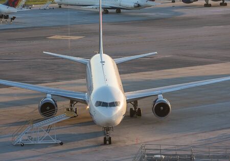 An airplane below on the tarmacの写真素材