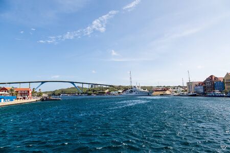 Massive luxury yacht docked near bridge on Curacaoの写真素材