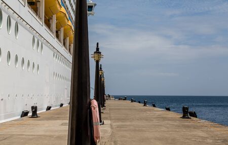 Lamp Posts on Pier by Cruise Ship on St Kittsの写真素材