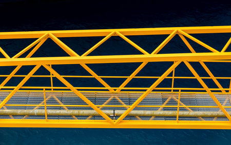 A yellow steel ganway over deep blue water in the Caribbeanの写真素材