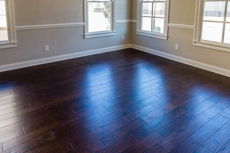 Light Through UV Windows onto Hardwood Floor in New Houseの写真素材