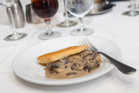 Fresh baked puff pastry with rich mushroom gravy insideの写真素材