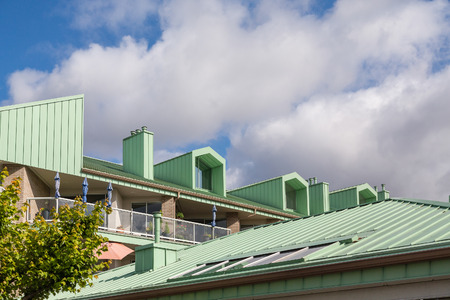 Green Metal Roof on Apartment buildingの写真素材