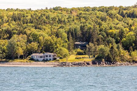 Mansions on the evergreen covered coast of Maineの写真素材