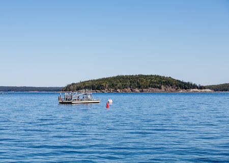 A Boat Boarding Ramp Moored in Harborの写真素材