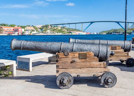 Old cannons on walkway in Curacaoの写真素材