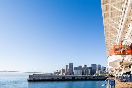 View of the coast of San Fransisco with piers, Bay Bridge and skyscrapersの写真素材