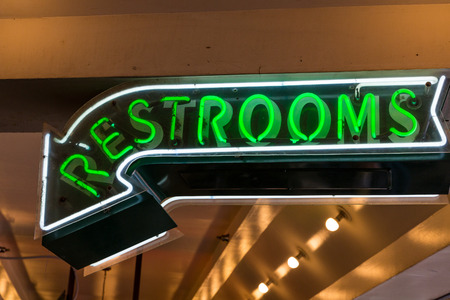 An old Restroom Sign in Green Neonの写真素材