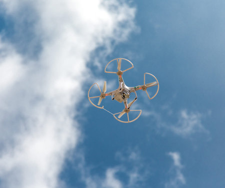 Drone From Below Against Blue Sky