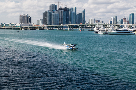 Small Seaplane Taxiing Past Miamiの写真素材
