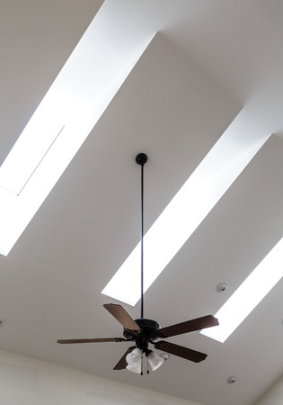 Ceiling Fan and Skylights on White Ceilingの写真素材