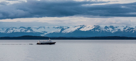 Dramatic clouds over mountains in the wilderness of Alaskaの写真素材