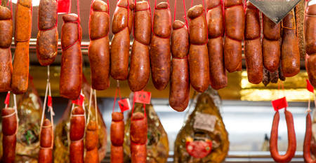 Fresh sausages hanging in a Spanish marketの写真素材