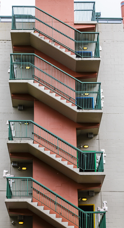 Green and Red Industrial Steps on Building Exteriorの写真素材