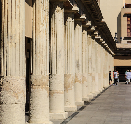 People Beyond Spanish Columns in Barcelonaの写真素材