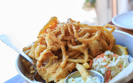 Fish and Chips with Onion Strings and Coleslawの写真素材