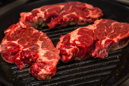 Three Chuck Steaks on Skilletの写真素材