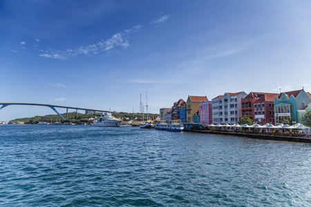 WILLEMSTAD, CURACAO - December 19, 2015: While still an industrial shipping port, Willimestad, with its colorful architecture is becoming a Caribbean tourist mecca and cruise ship destination.のeditorial素材