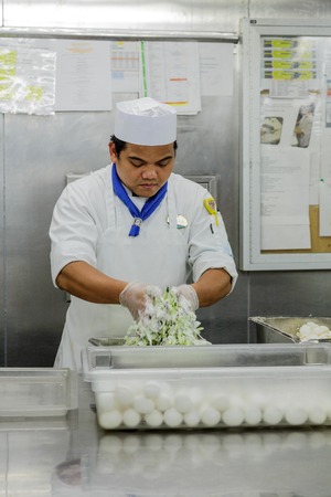 MIAMI, FLORIDA - December 21, 2015: Kitchen staff on cruise ships, including chefs and cooks, work some of the hardest and longest hours as the kitchens are in operation 24 hours a day.のeditorial素材