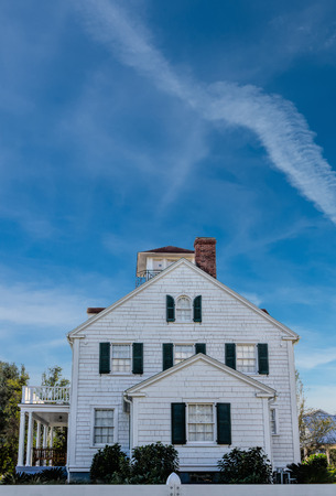 White Clapboard House Under Nice Skyの写真素材