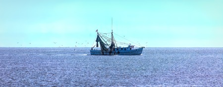 Shrimp Boat on Sunny Seaの写真素材